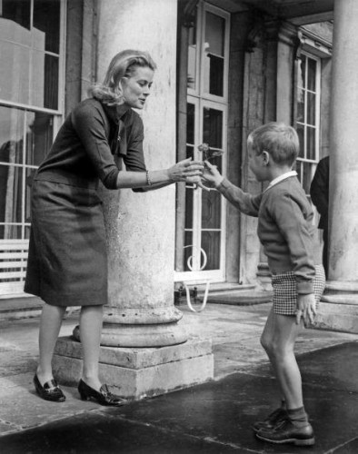 Prince Albert presents a flower to his mother