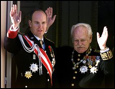 Monaco's Prince Rainier and his son Prince Albert wave in November 1999 file photo during Confederation Day ceremonies
