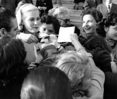 1955 Grace Kelly with fans at Cannes
